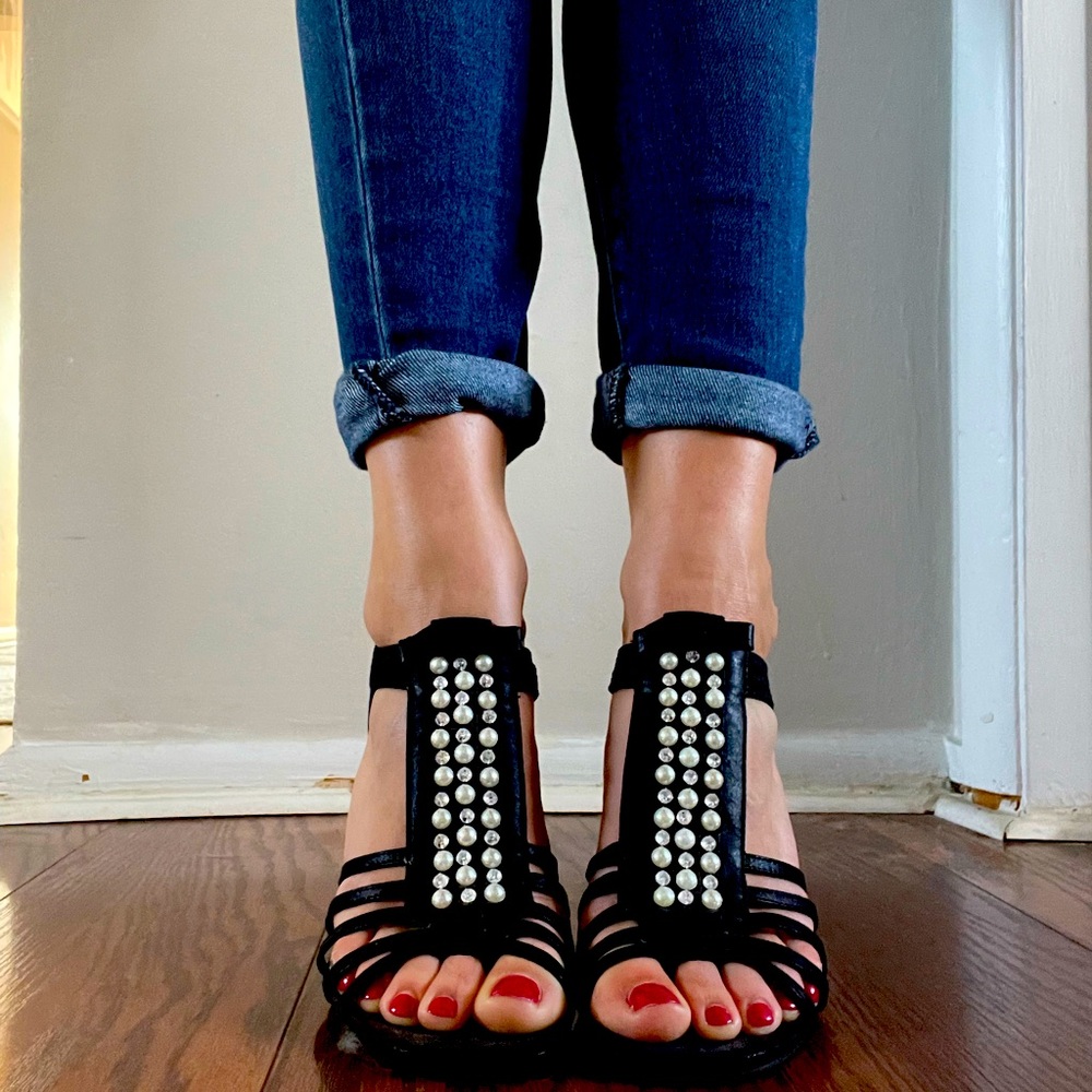 Black high heels with pearl accents